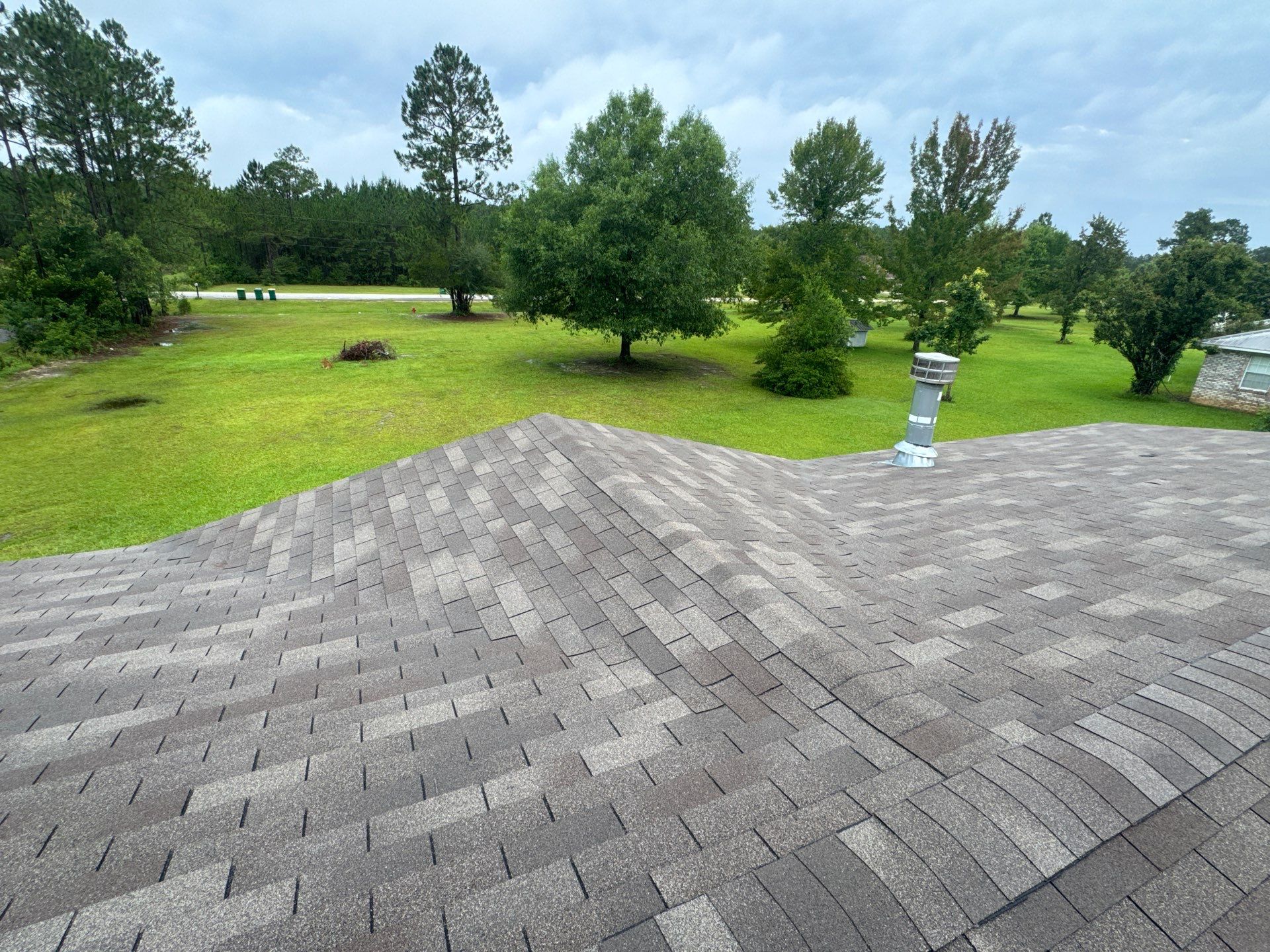 Fresh architectural shingle roof with new vent pipe flashing